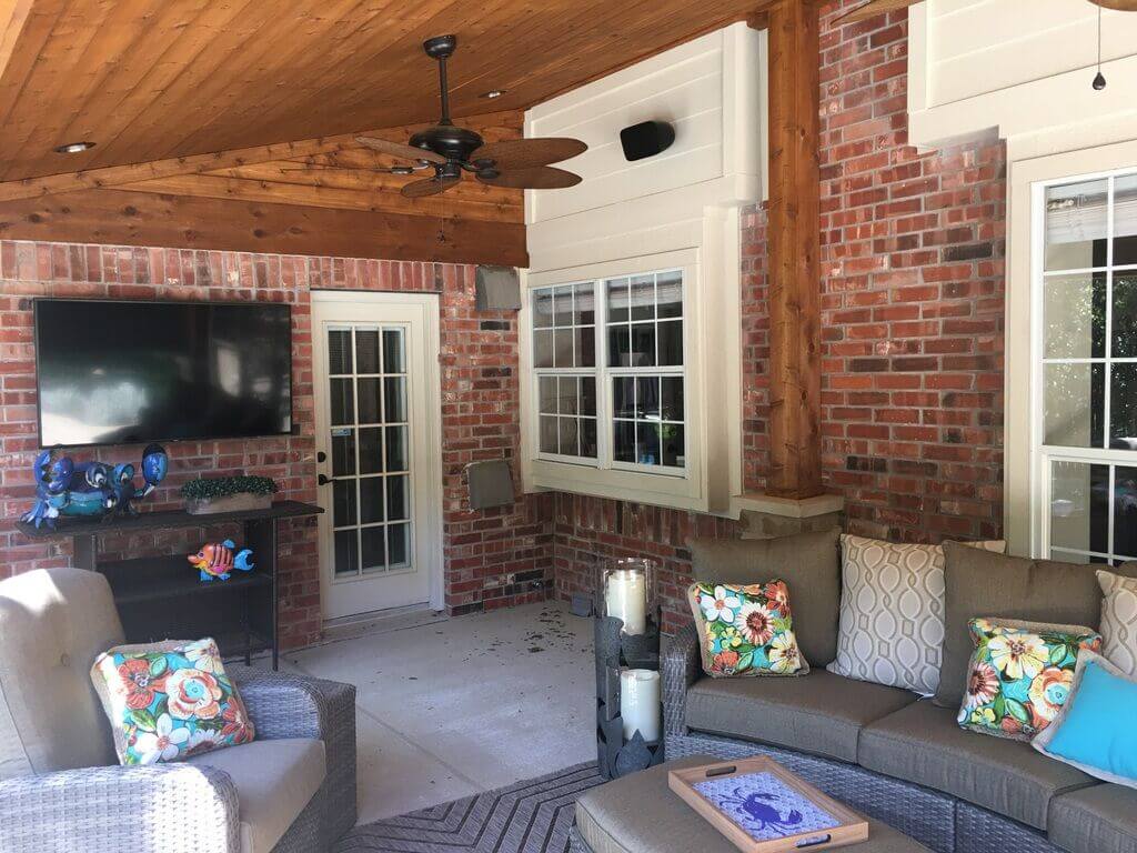Seating area with flat TV on covered patio