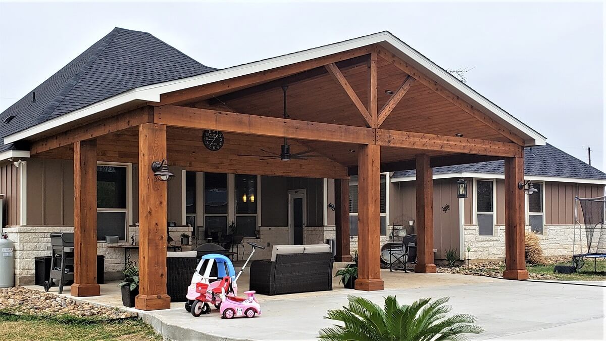 New covered patio with parked toy vehicles