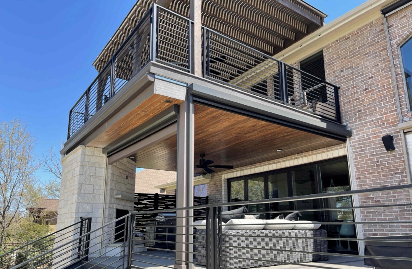 exterior of a back of a home with a deck