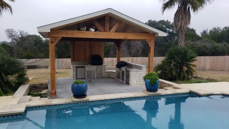 a gazebo by a swimming pool