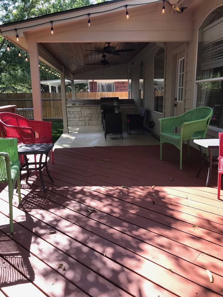 Deck and covered patio with outdoor kitchen