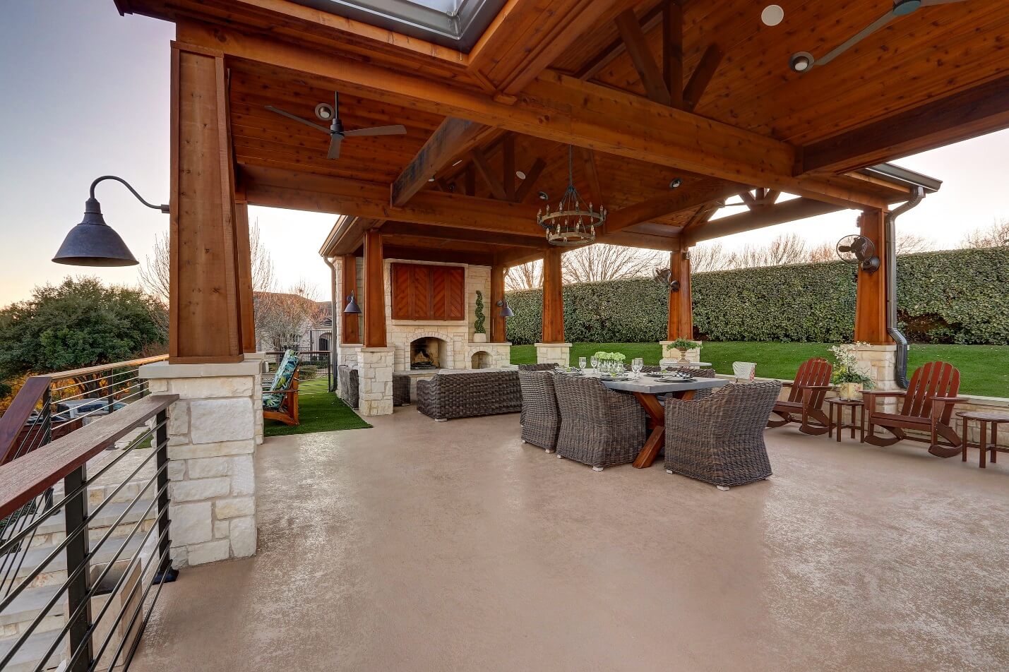 Backyard outdoor space with dining area and outdoor fireplace