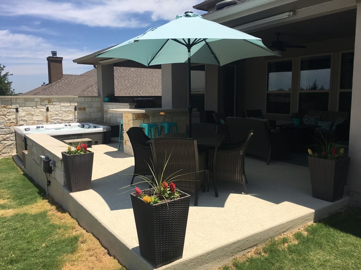 Outdoor space with spa deck and seating area