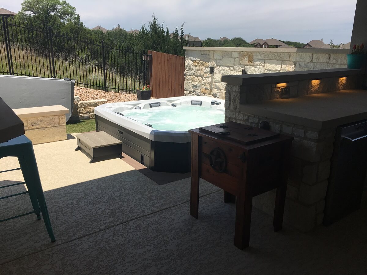 Custom outdoor kitchen on patio and hot tub deck