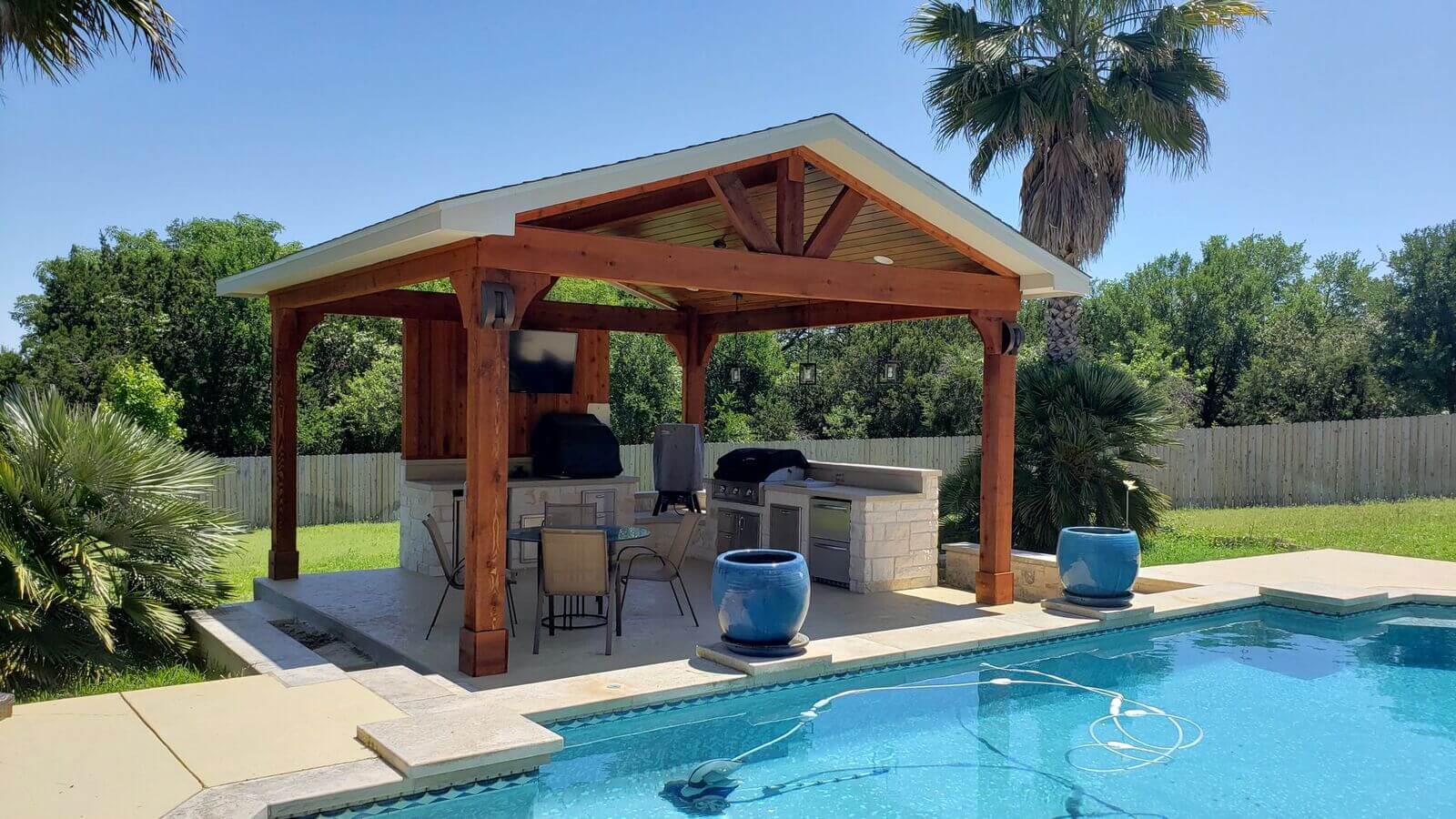 Custom pool cabana with outdoor kitchen