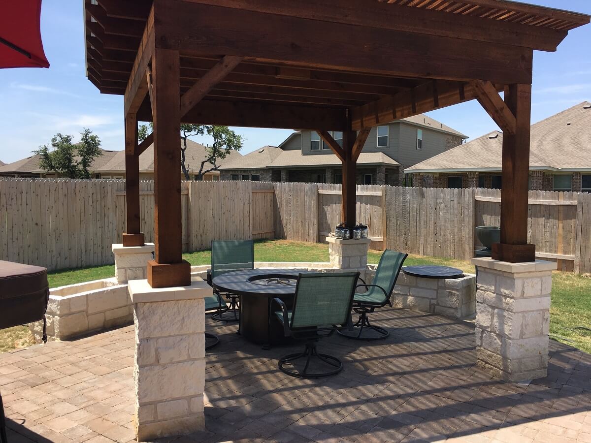 Patio with pergola over seating area