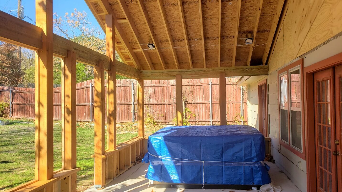 Covered porch with hot tub
