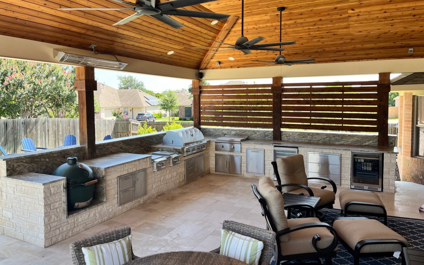 A patio with a grill and a table

Description automatically generated with medium confidence