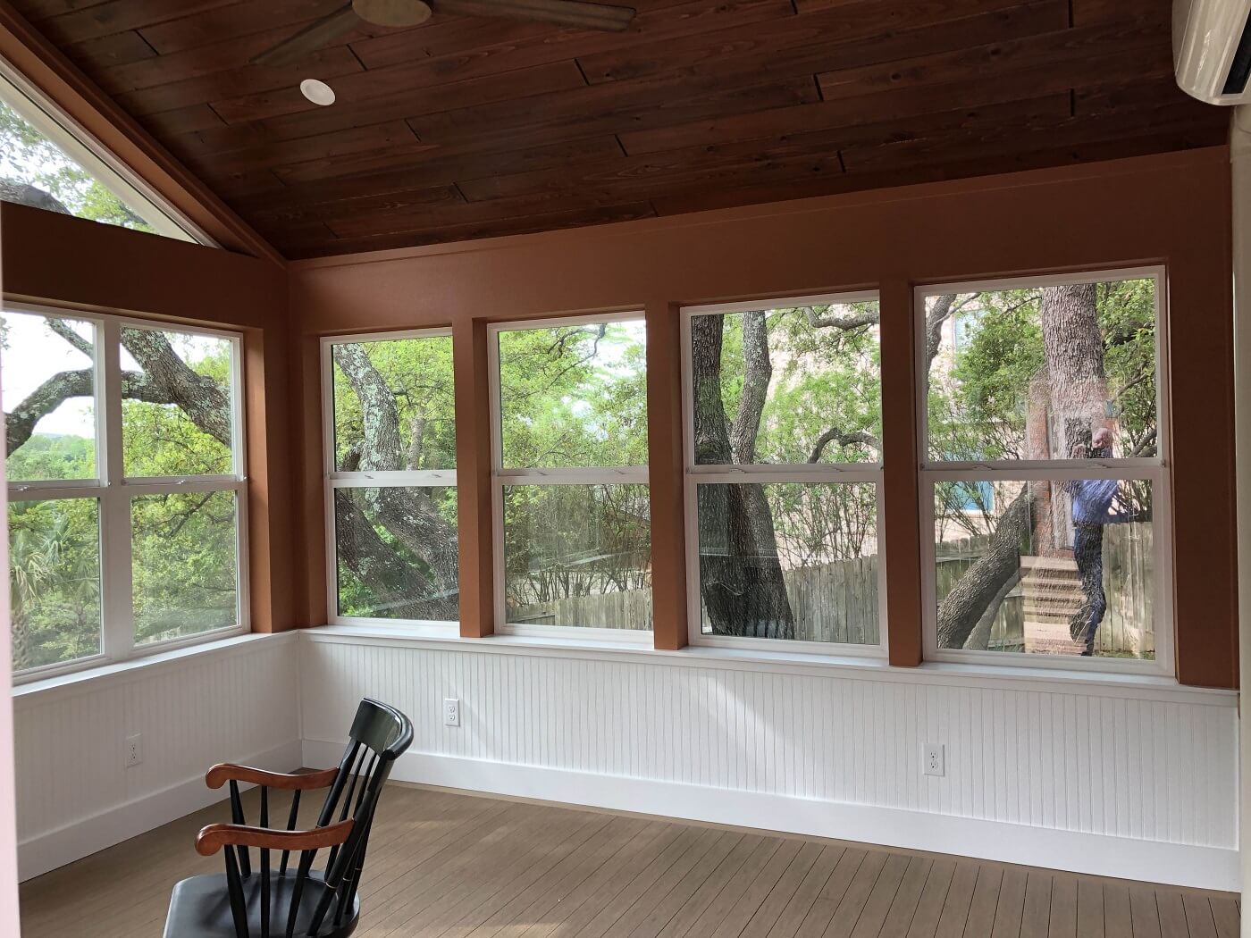 Interior view of sunroom with rocking chair