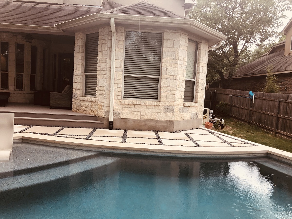 custom poolside outdoor living space