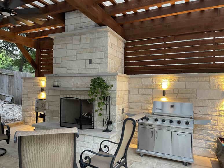 patio cover with outdoor fireplace and grill area
