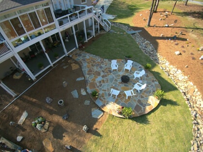 screened porch with stone patio