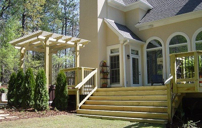 wooden deck with stairs and pergola