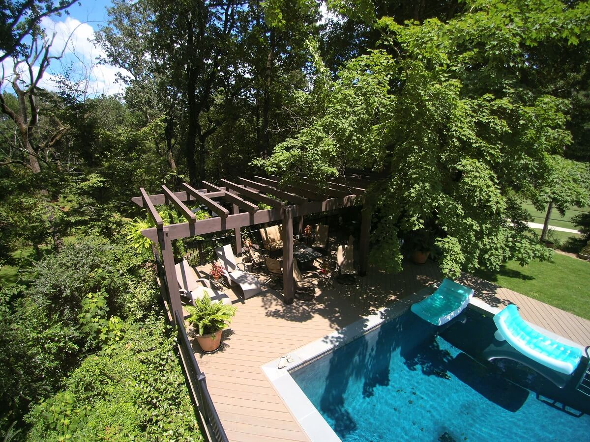 Aerial view of pool with deck & pergola