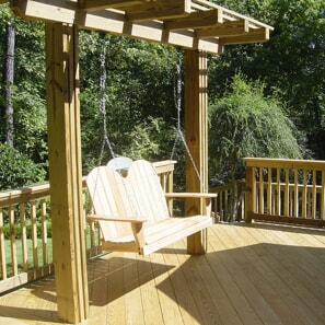 Pressure treated deck in Hoover, AL, featuring a custom pergola swing.