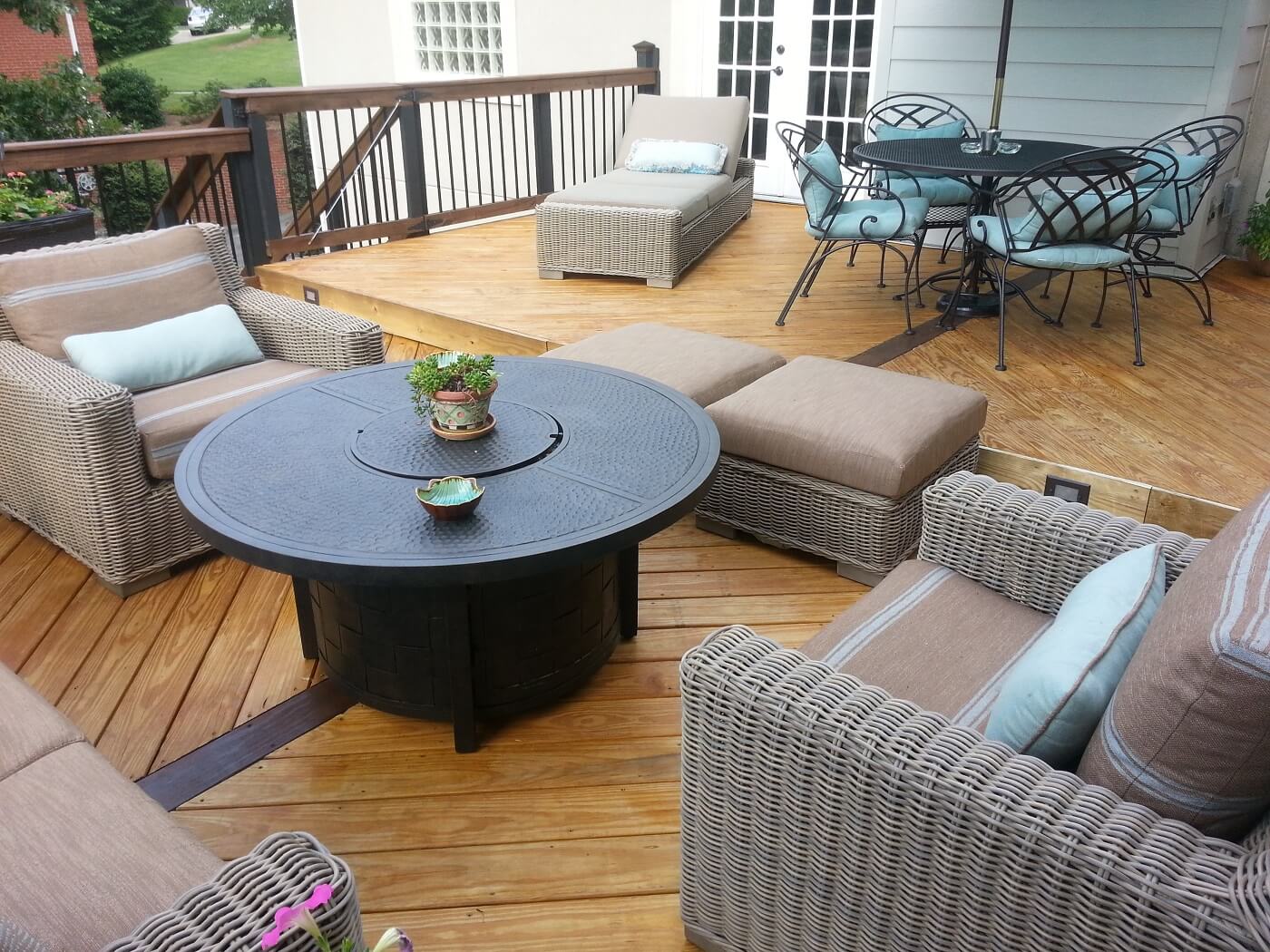 Custom wood deck with balusters and lounge area