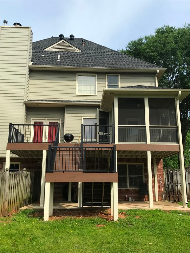 Front view of custom deck with railing and staircase