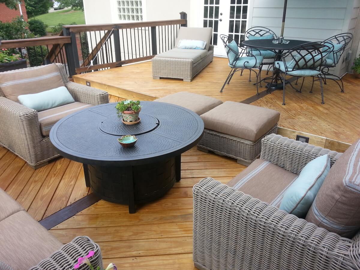 Cozy wood deck with balusters and lounge area