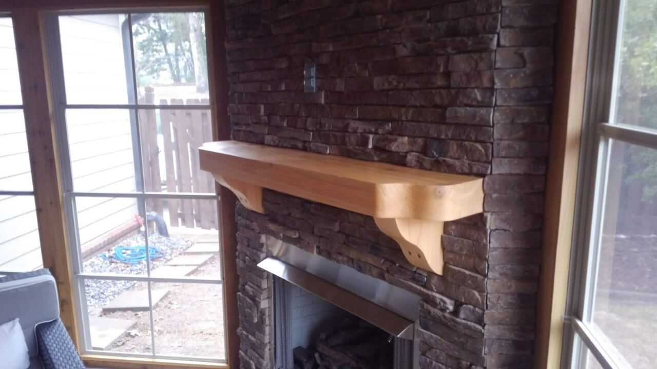 Custom wood mantel over fireplace
