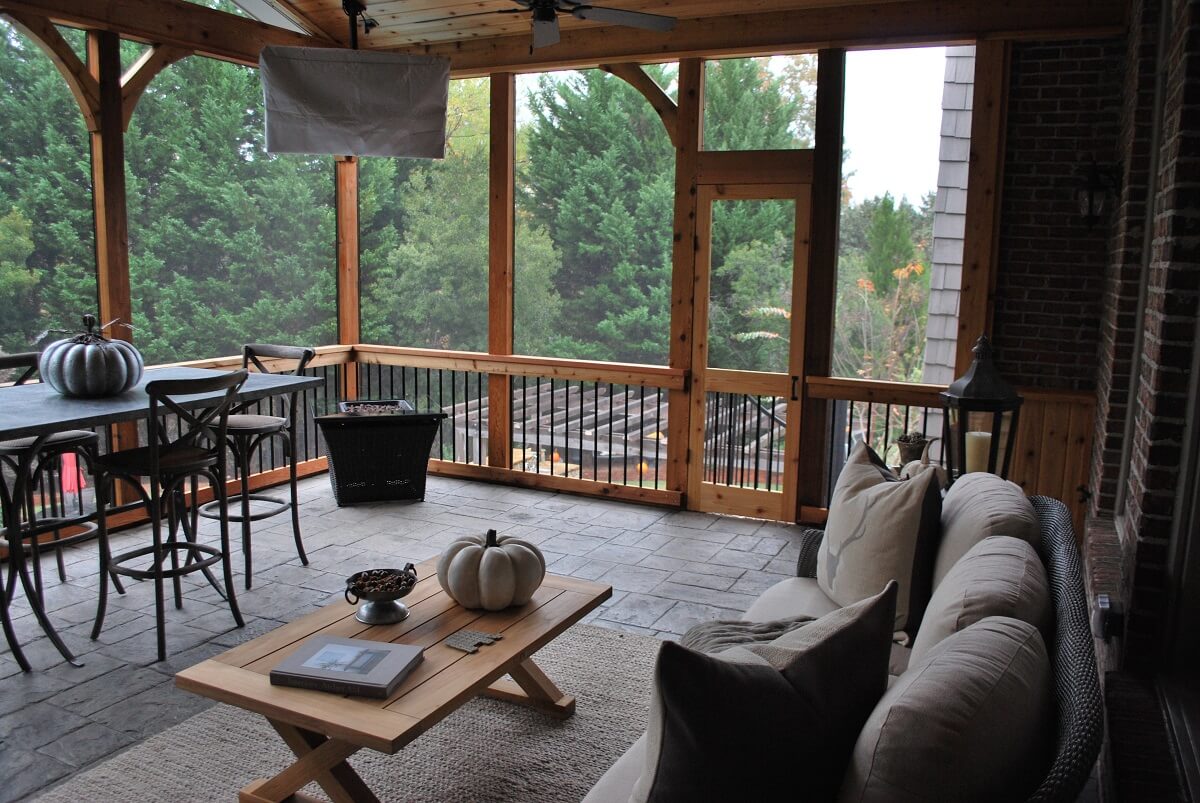 Screened porch with dining area and seating area