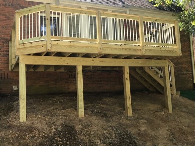 Elevated wood deck with balusters