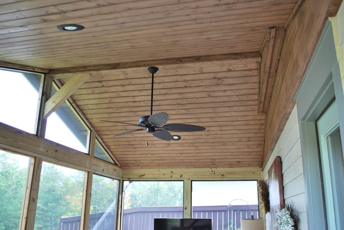 Screened porch ceiling with fan and lighting