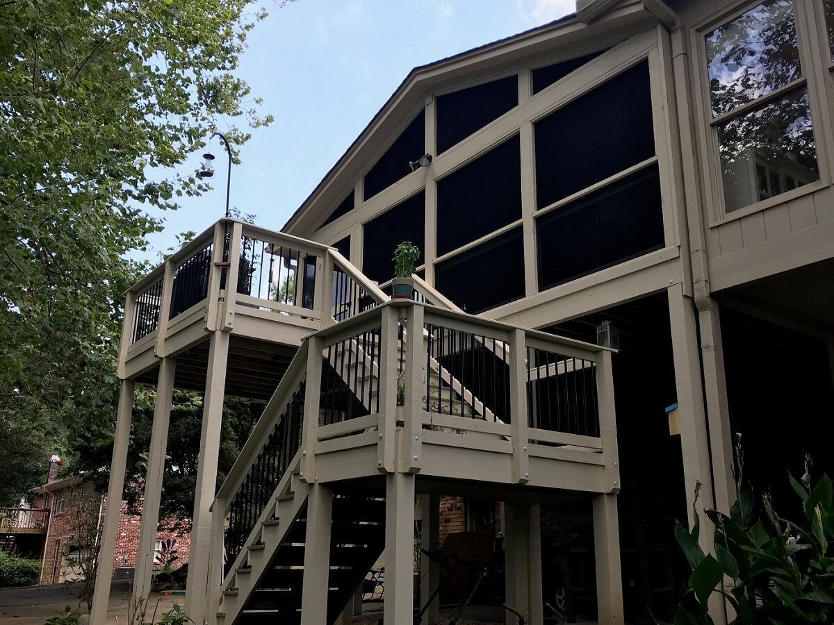 Exterior view of screened porch and deck with stairs