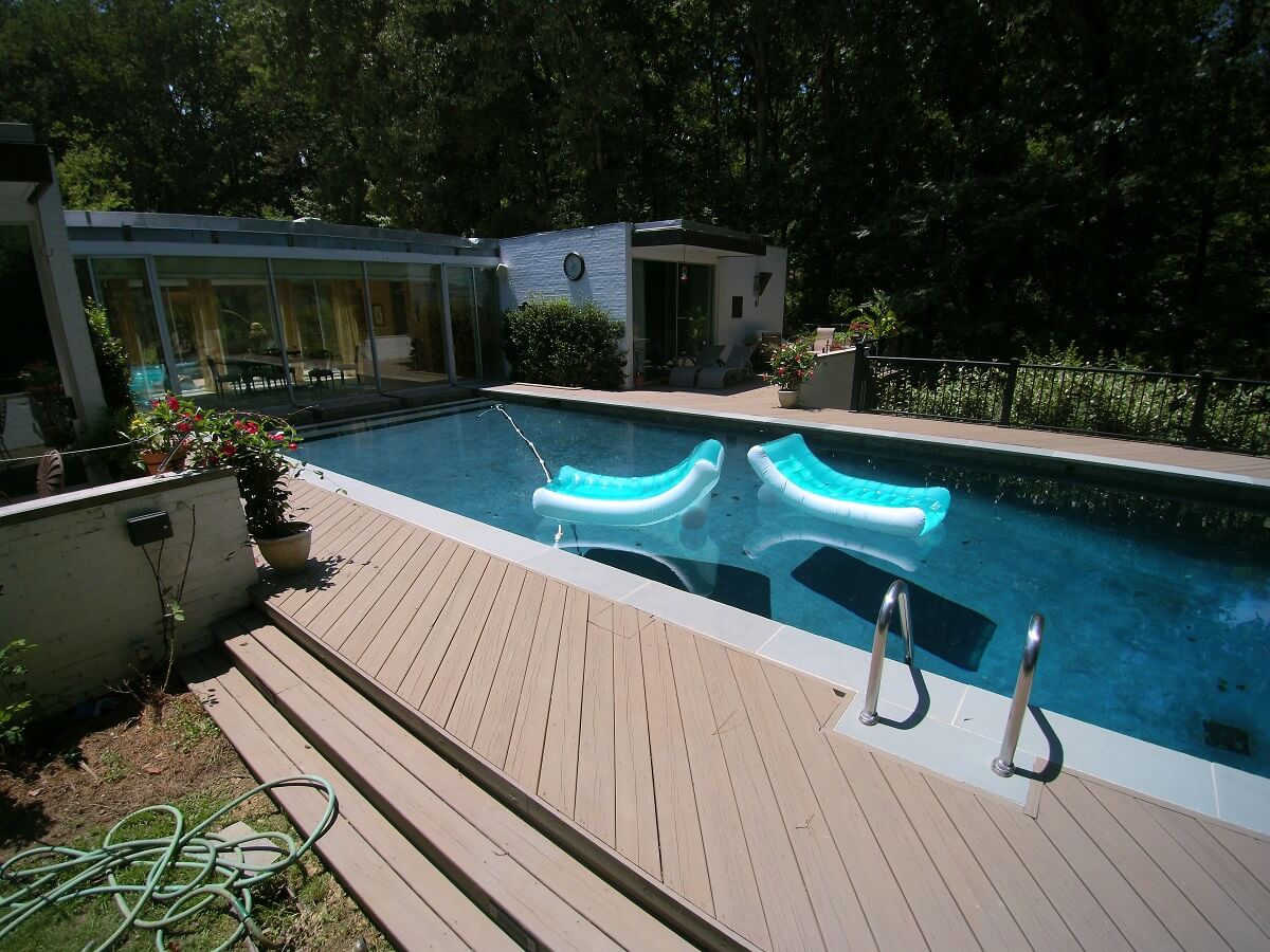 Wood deck and swimming pool with floaters