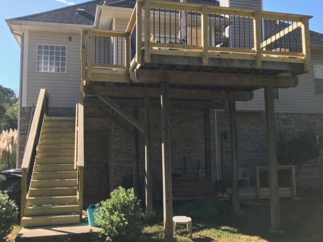 Custom backyard wood deck with staircase