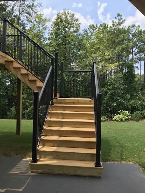 Wood deck stairs with railing
