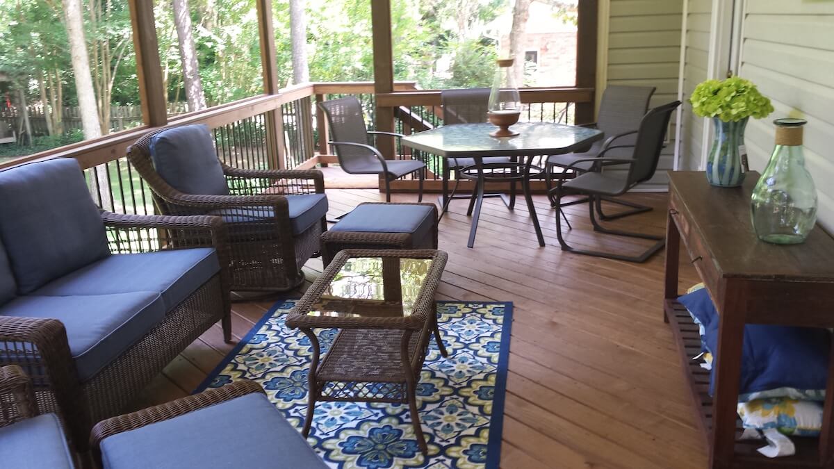 Custom screened porch and deck with seating area
