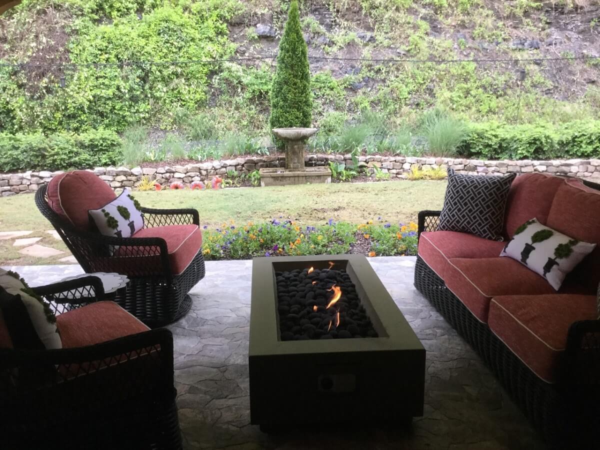 Covered porch with fire pit and water fountain view