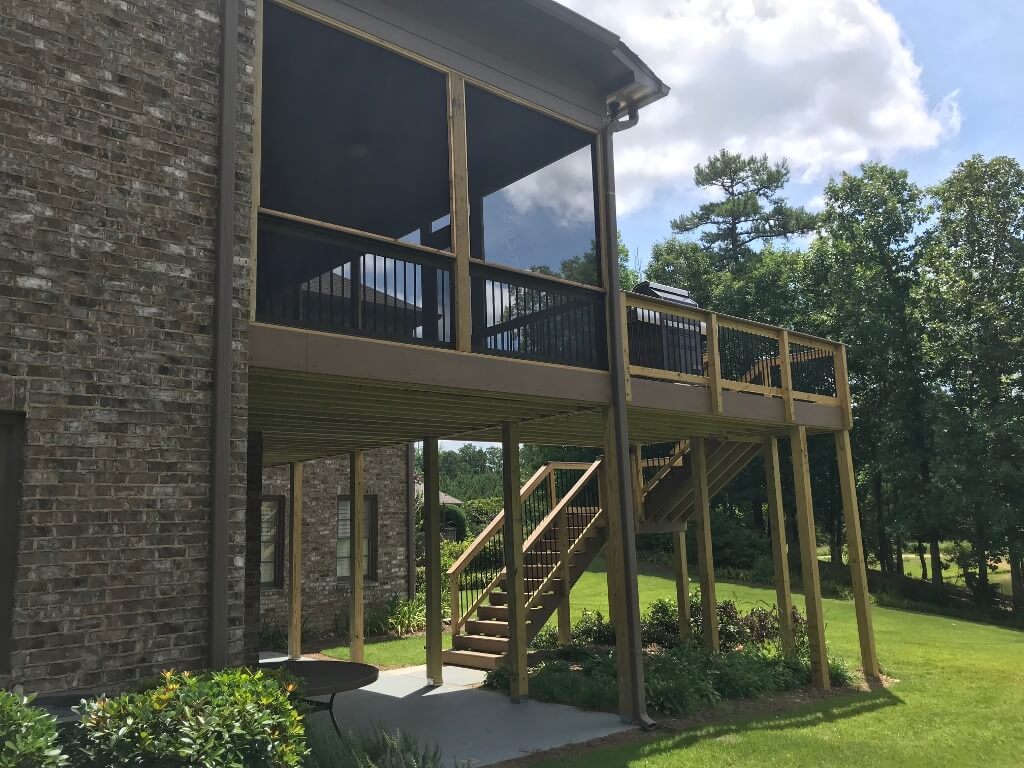Back view of screened porch and wood deck