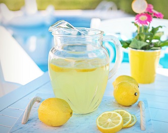Pitcher of lemonade and lemons