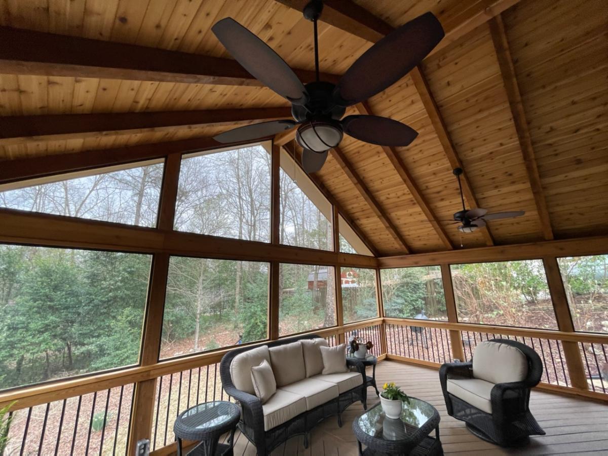 interior of north shelby county screened porch cedar exposed rafter ceiling