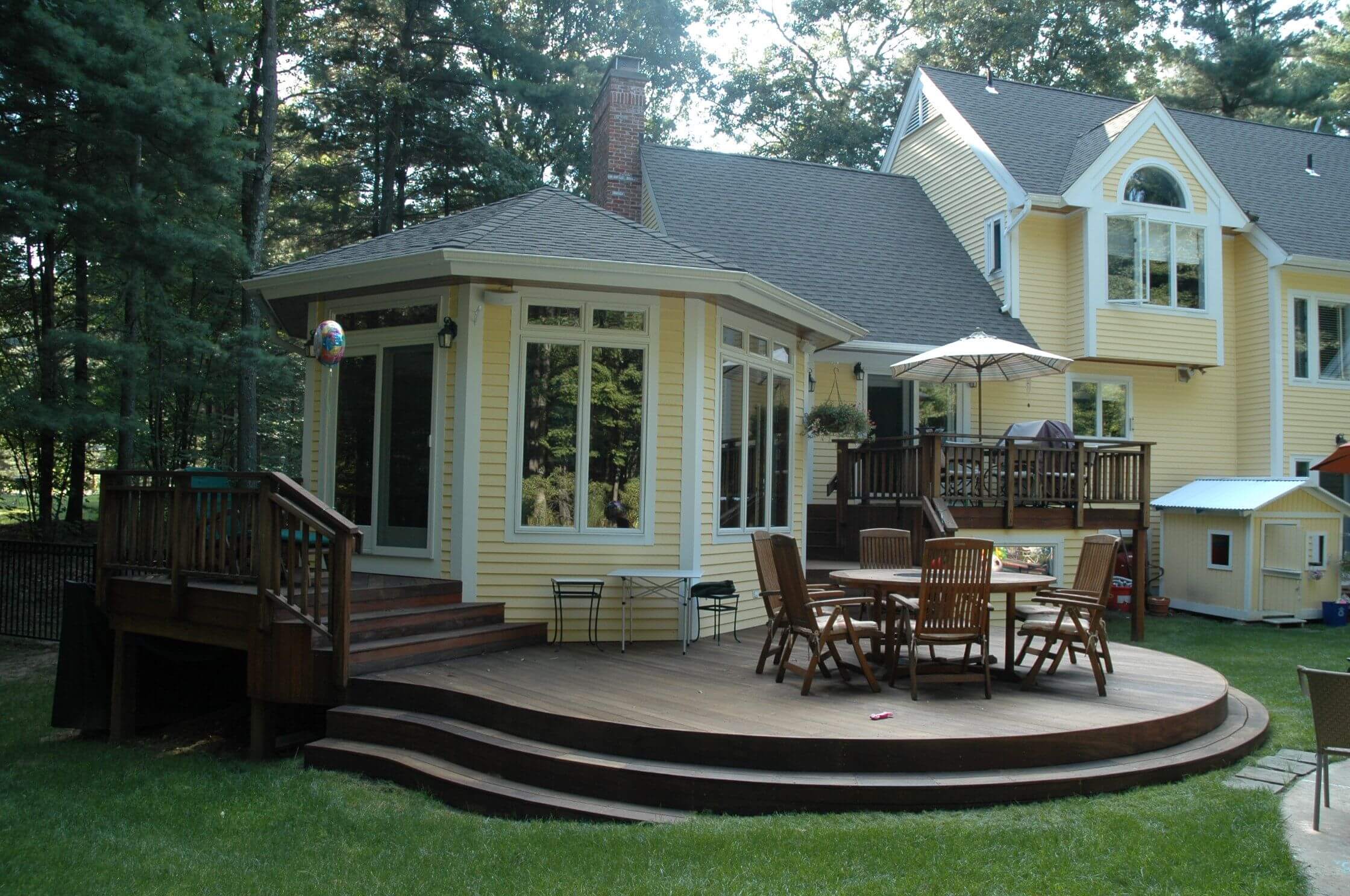 Custom backyard multi-level deck with seating area