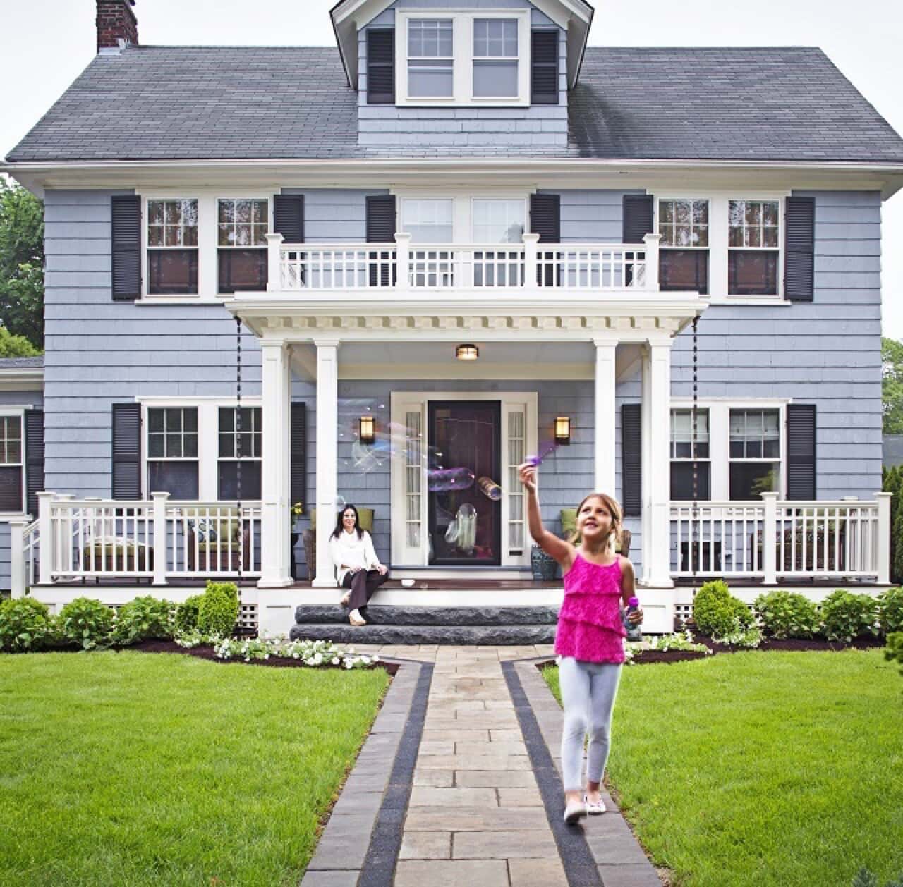 girl in front of porch