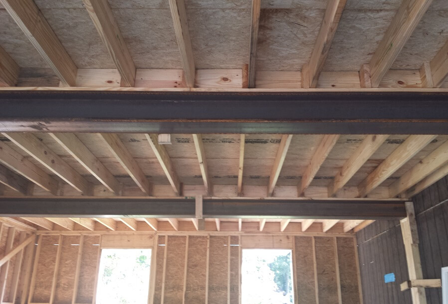 Garage construction details with wood and steel beams
