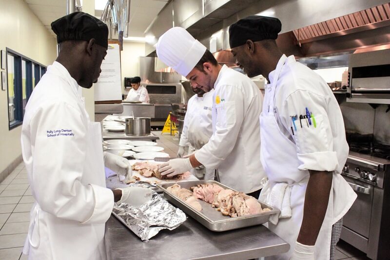 Students slicing meat
