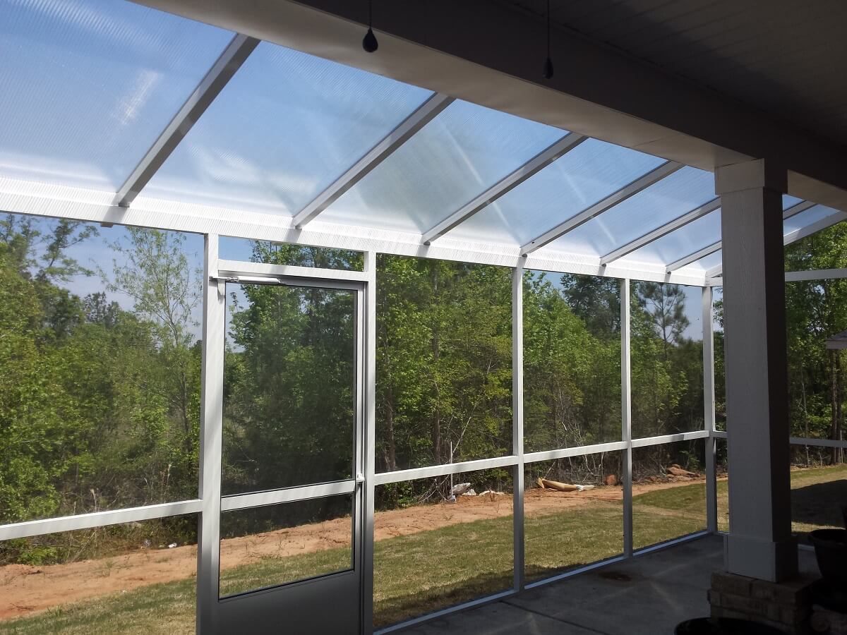 Interior of screened porch with backyard view