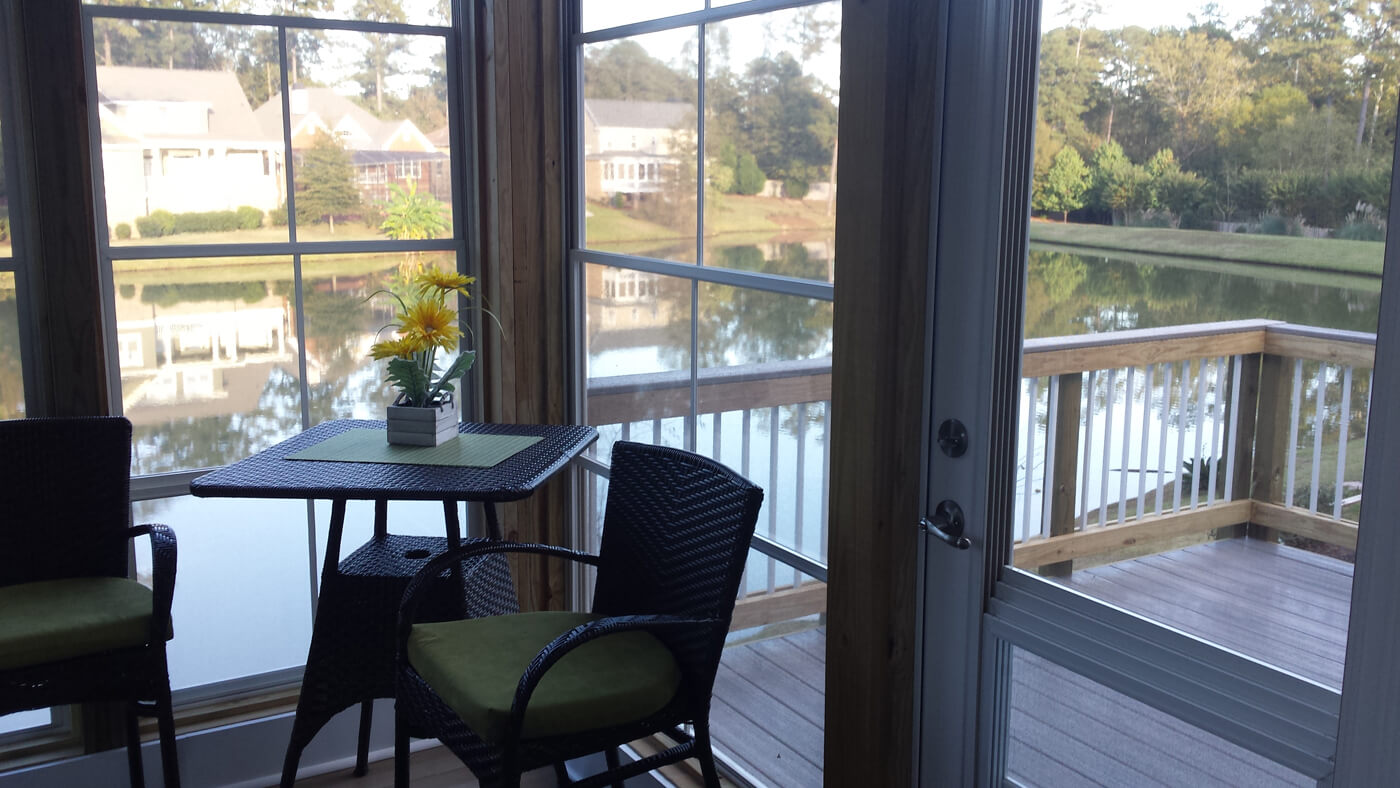 Screened porch overlooking water