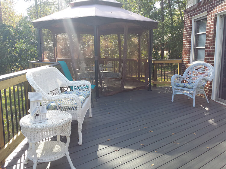 Wood deck and screened porch with seating area