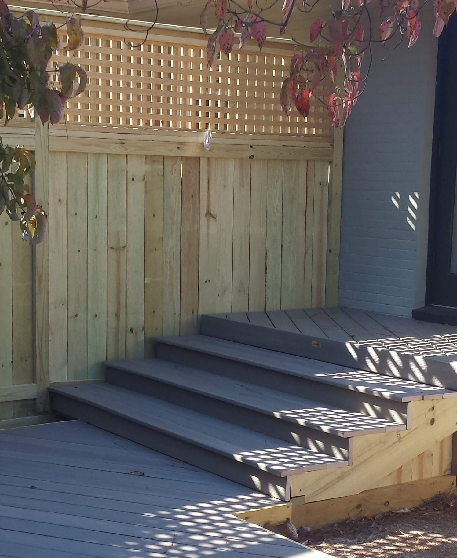 New wood deck with stairs and privacy wall