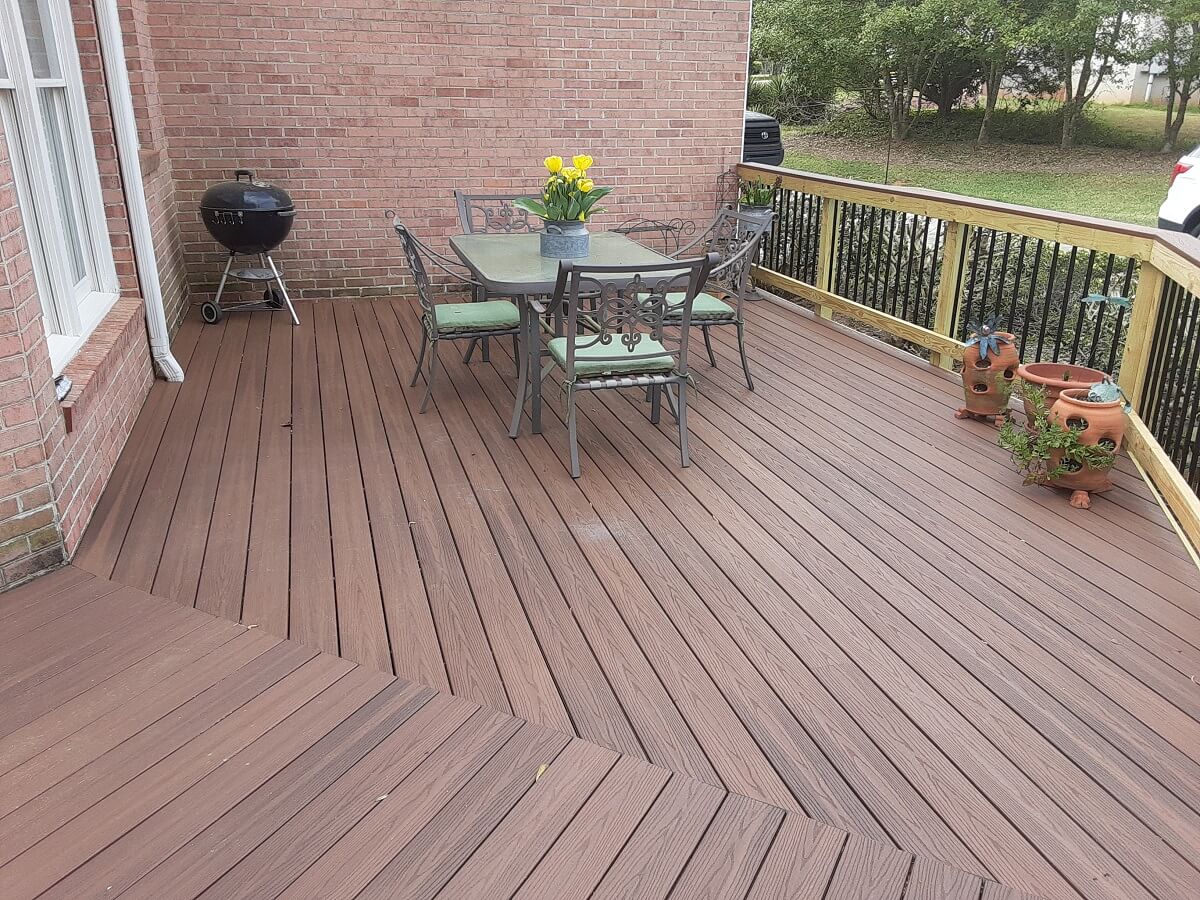 Custom wood deck with dining area and outdoor kitchen
