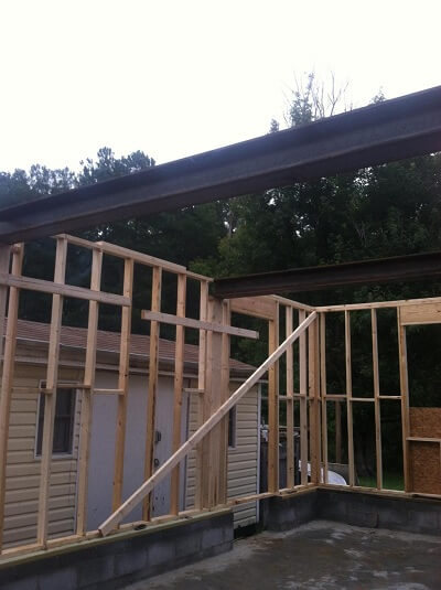 Wood and steel beams for garage construction