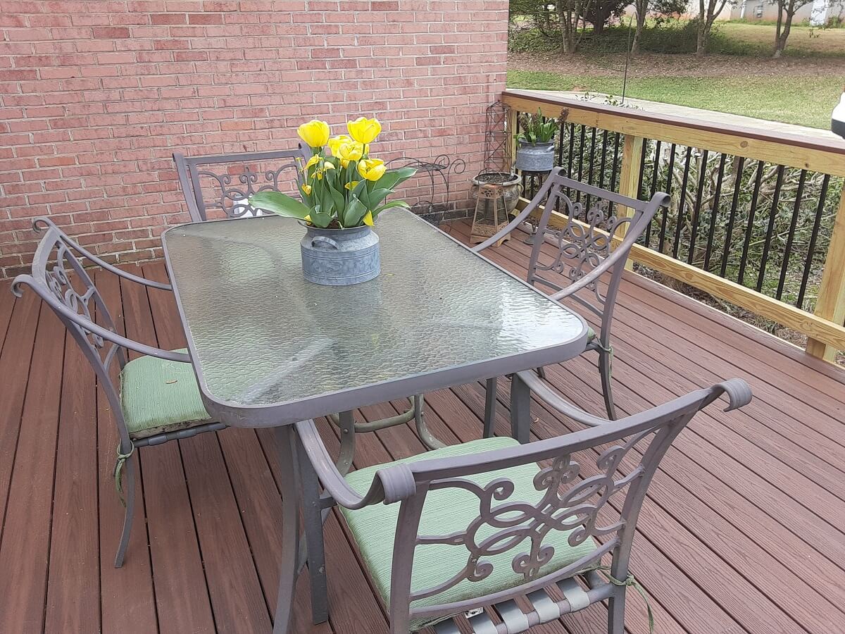 Dining area with flower decor on new wood deck