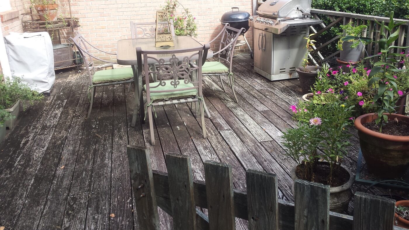 Old deck with dining area and outdoor kitchen
