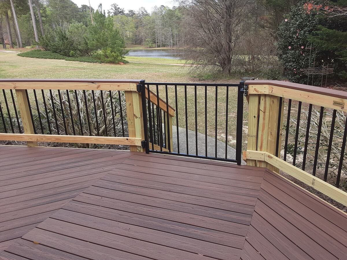 Custom deck gate and backyard view