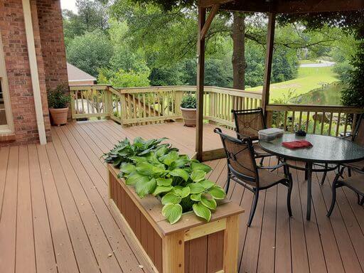 Custom deck with planter box and seating area