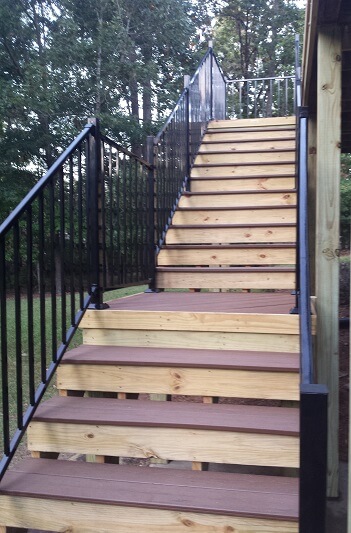 Deck staircase with iron railing